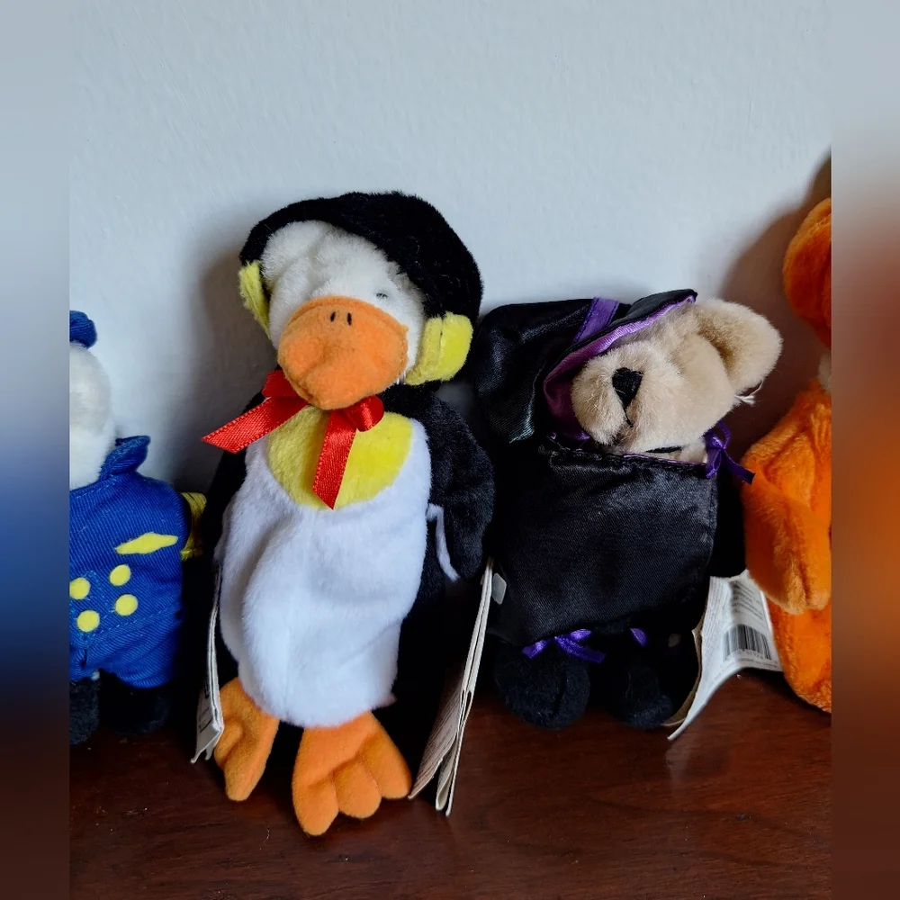 Collectible teddy bears from the Ganz brand, specifically from the Wee Bear Vill